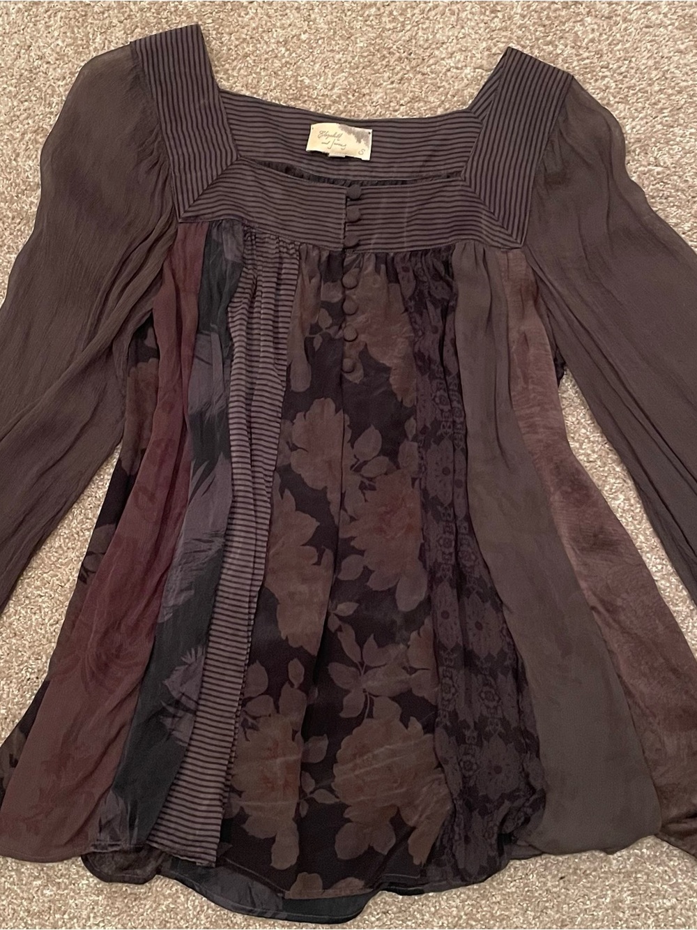 100% Silk square neck blouse. Sheer sleeves with single button cuff.